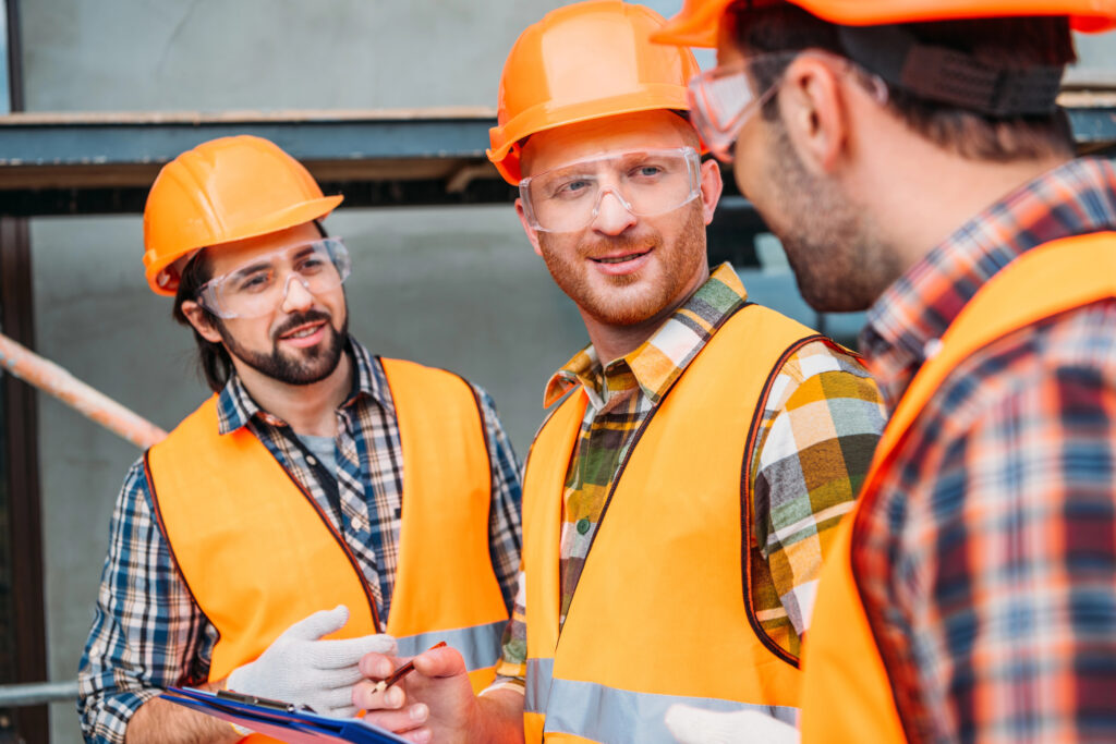 three men in hardhats representing a stakeholder group of engineers