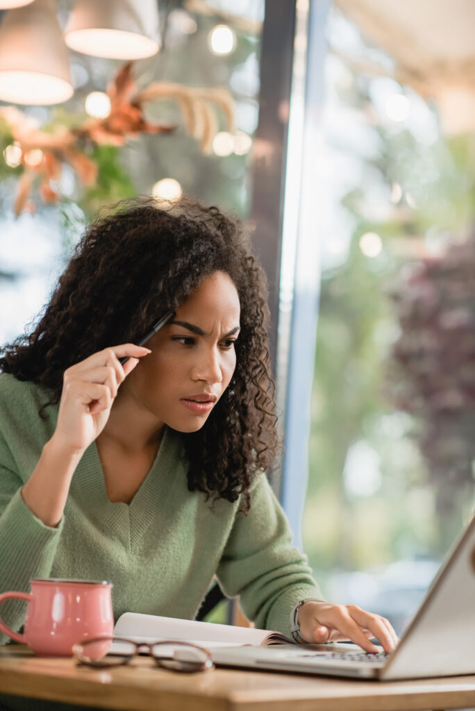 woman concentrating working on a report on her computer